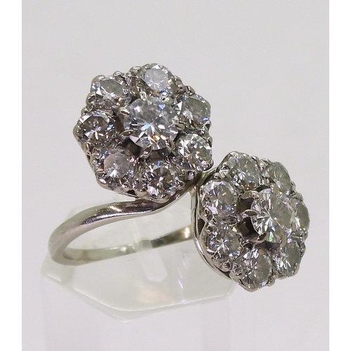 2804 - A DIAMOND DOUBLE FLOWER RINGmounted in white metal and set with estimated approx 2.50cts in total., ... 