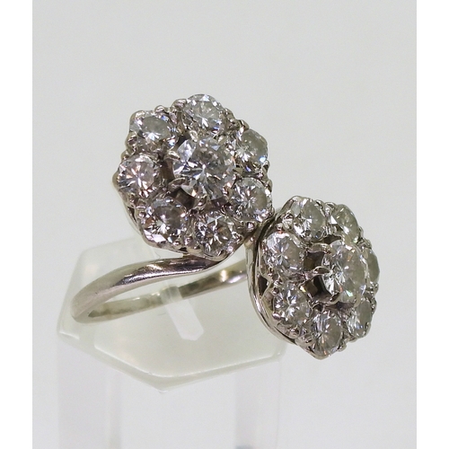 2804 - A DIAMOND DOUBLE FLOWER RINGmounted in white metal and set with estimated approx 2.50cts in total., ... 