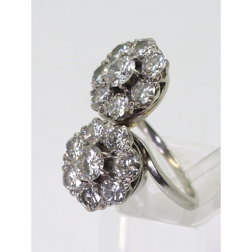 2804 - A DIAMOND DOUBLE FLOWER RINGmounted in white metal and set with estimated approx 2.50cts in total., ... 