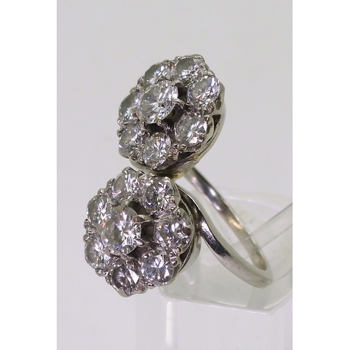 2804 - A DIAMOND DOUBLE FLOWER RINGmounted in white metal and set with estimated approx 2.50cts in total., ... 