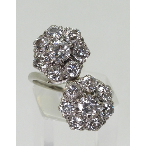 2804 - A DIAMOND DOUBLE FLOWER RINGmounted in white metal and set with estimated approx 2.50cts in total., ... 