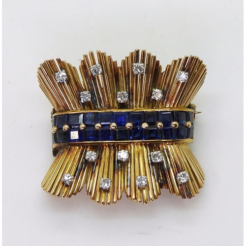 2805 - A RETRO SAPPHIRE & DIAMOND BROOCHcraftsman made in bright yellow metal, set with a double band o... 