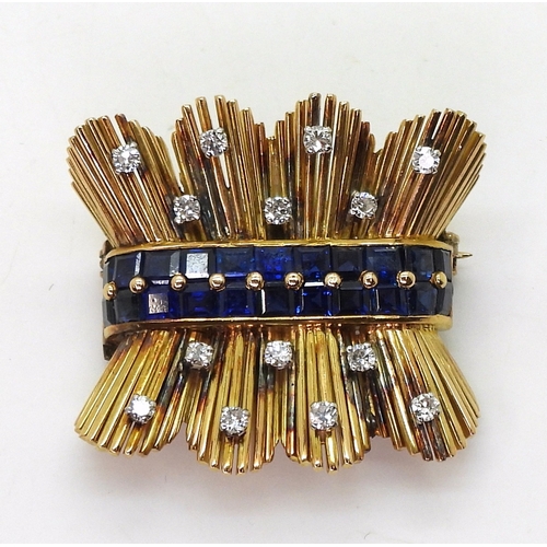 2805 - A RETRO SAPPHIRE & DIAMOND BROOCHcraftsman made in bright yellow metal, set with a double band o... 