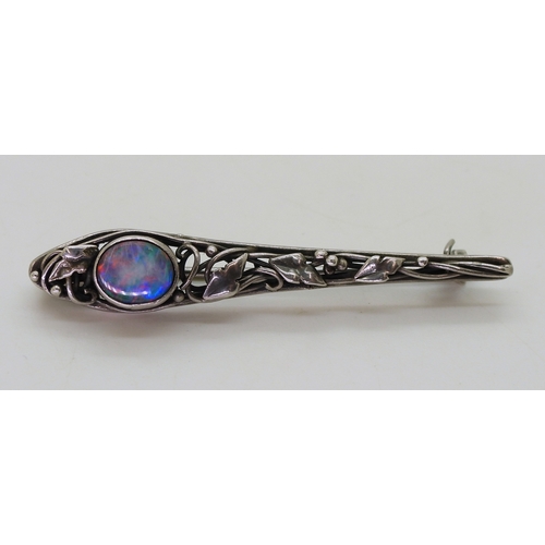 2806 - AN ART & CRAFTS BROOCHpossibly by Rhoda Wager circa 1920's. the white metal bar brooch with leaf... 