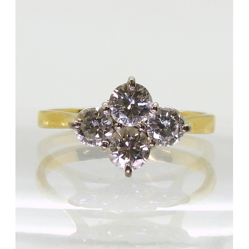 2808 - A FOUR STONE DIAMOND RINGset in 18ct yellow gold basket setting, the brilliant cut diamonds have a e... 