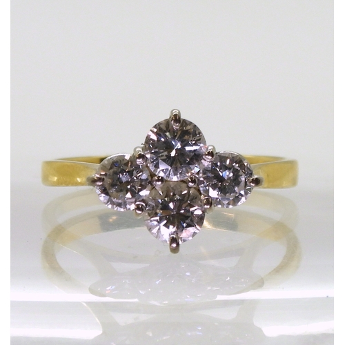 2808 - A FOUR STONE DIAMOND RINGset in 18ct yellow gold basket setting, the brilliant cut diamonds have a e... 