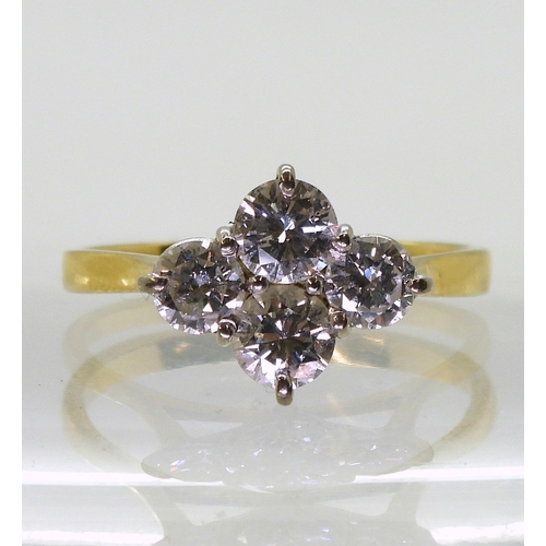 2808 - A FOUR STONE DIAMOND RINGset in 18ct yellow gold basket setting, the brilliant cut diamonds have a e... 