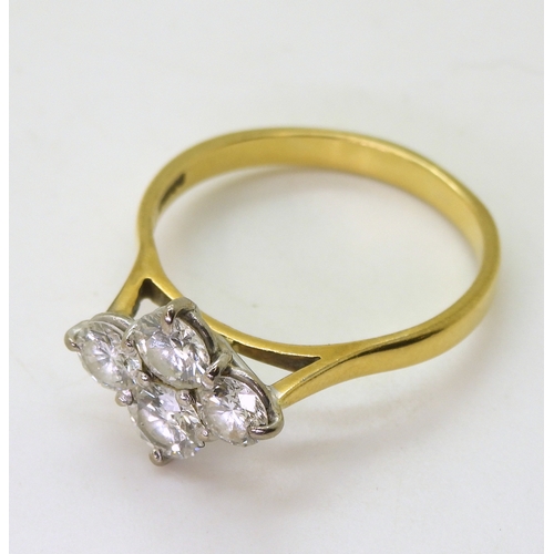 2808 - A FOUR STONE DIAMOND RINGset in 18ct yellow gold basket setting, the brilliant cut diamonds have a e... 