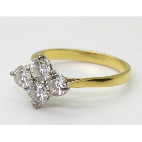 2808 - A FOUR STONE DIAMOND RINGset in 18ct yellow gold basket setting, the brilliant cut diamonds have a e... 