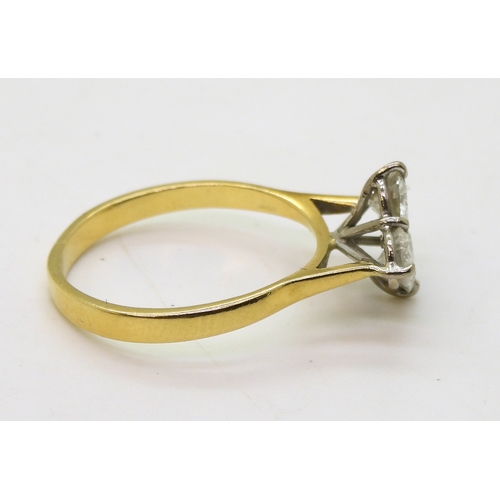 2808 - A FOUR STONE DIAMOND RINGset in 18ct yellow gold basket setting, the brilliant cut diamonds have a e... 