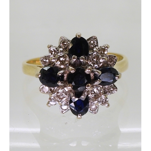 2812 - A SAPPHIRE & DIAMOND CLUSTER RINGwith a classic 18ct gold basket setting. set with four oval sap... 