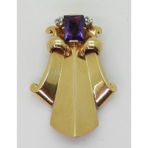 2814 - A FLEUR DE LIS DRESS CLIPmade in 14k gold and platinum, set with a mixed cut amethyst and diamond ac... 