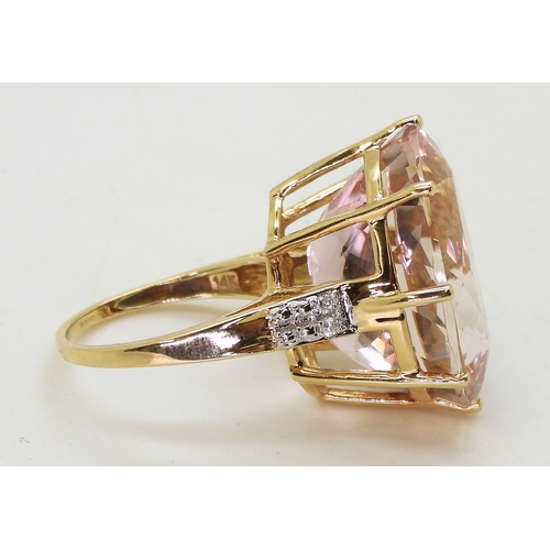 2817 - A KUNZITE STATEMENT RINGmeasuring 20mm x 15mm x 11mm, in 14k gold multi claw basket setting, with di... 