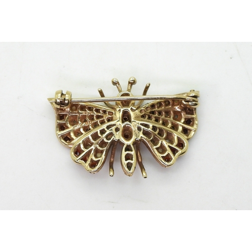 2820 - A COLLECTION OF JEWELSA 9ct gold garnet and pearl set butterfly brooch, stamped H&T, with London... 