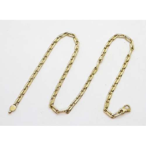 2821 - A 9CT GOLD FANCY CHAINof twisted baton links, length 44.5cm, weight 24.9gms