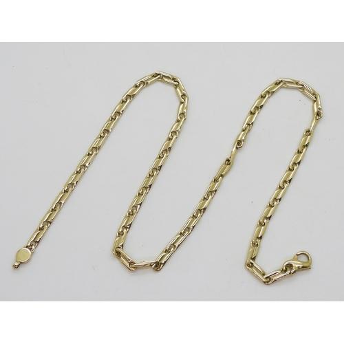 2821 - A 9CT GOLD FANCY CHAINof twisted baton links, length 44.5cm, weight 24.9gms