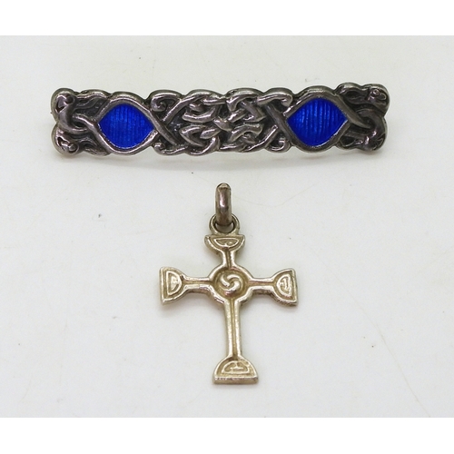 2822 - TWO ALEXANDER RITCHIE JEWELSan early brooch, with blue enamel among the knotwork and four zoomorphic... 