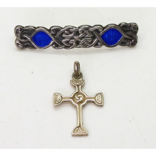 2822 - TWO ALEXANDER RITCHIE JEWELSan early brooch, with blue enamel among the knotwork and four zoomorphic... 