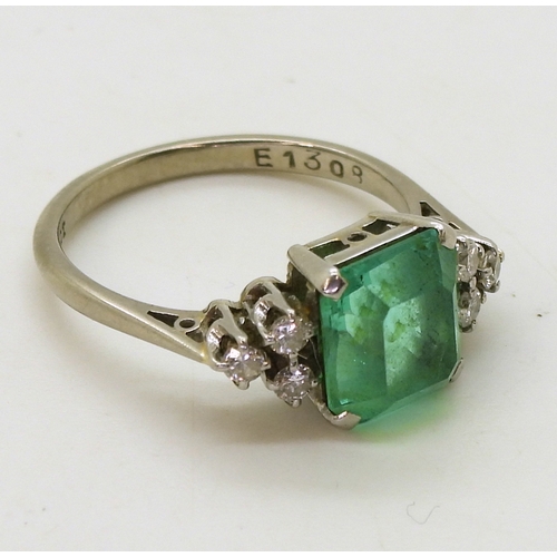 2826 - AN EMERALD AND DIAMOND RINGset in 18ct white gold and platinum, with a step cut emerald of approx 8.... 