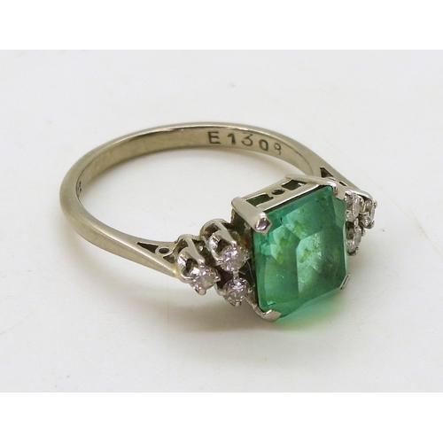 2826 - AN EMERALD AND DIAMOND RINGset in 18ct white gold and platinum, with a step cut emerald of approx 8.... 