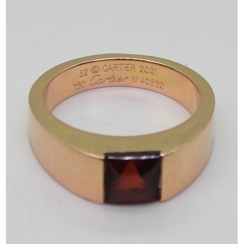 2829 - A CARTIER GARNET RINGmade in 18ct rose gold, fully signed Cartier 52 2001, with the serial number N4... 