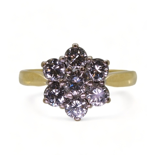 2836 - A DIAMOND FLOWER RINGset with estimated approx 1.20cts of brilliant cut diamonds, in the classic flo... 