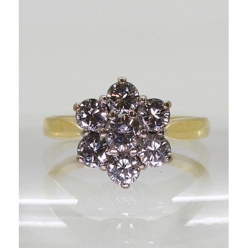 2836 - A DIAMOND FLOWER RINGset with estimated approx 1.20cts of brilliant cut diamonds, in the classic flo... 