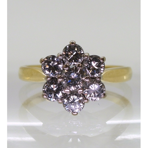 2836 - A DIAMOND FLOWER RINGset with estimated approx 1.20cts of brilliant cut diamonds, in the classic flo... 