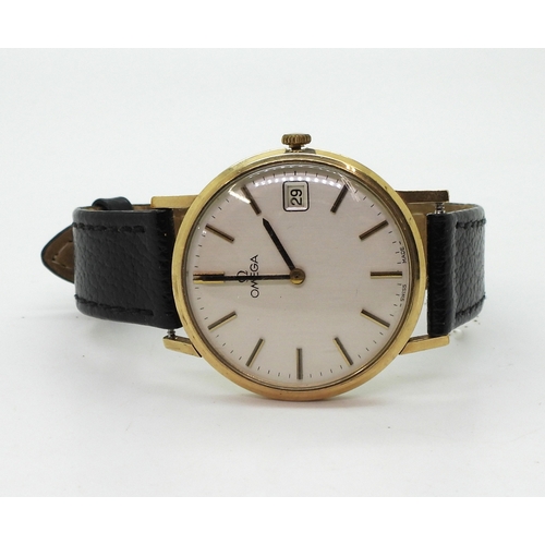 2921 - A 9CT GOLD GENTS OMEGA WATCHwith silvered dial, gold and black baton numerals and hands, with date a... 