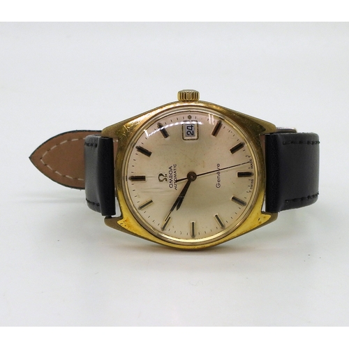 2930 - AN OMEGA AUTOMATIC GENEVEwith a gold plated case, date aperture cream dial with black & gold col... 