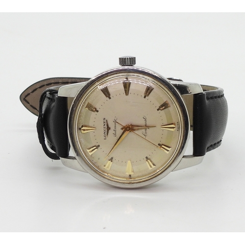 2931 - *WITHDRAWN* A LONGINES AUTOMATIC CONQUESTwith stainless steel case, cream dial with gold coloured ch... 