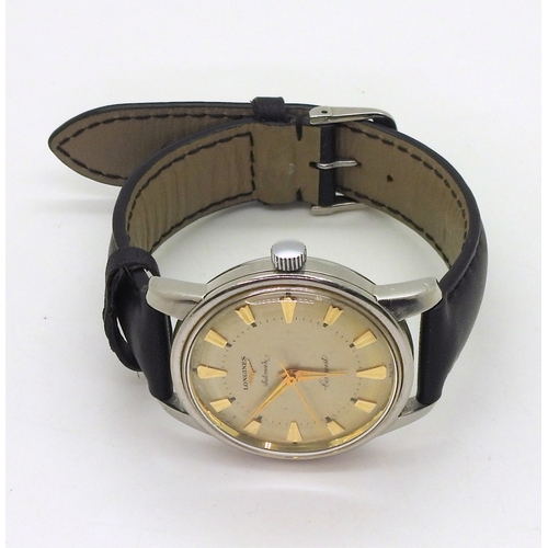 2931 - *WITHDRAWN* A LONGINES AUTOMATIC CONQUESTwith stainless steel case, cream dial with gold coloured ch... 