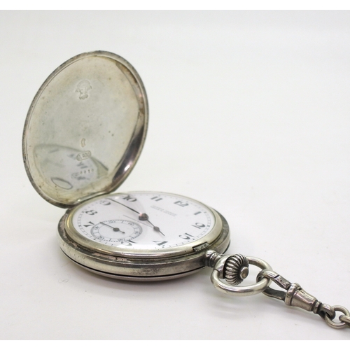 2933 - A ULYSSE NARDIN POCKET WATCHin continental silver full hunter case, The white enamelled dial is sign... 