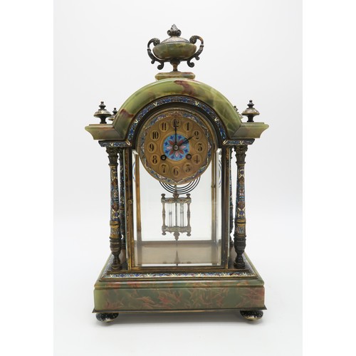 2270 - A FRENCH CHAMPLEVE ENAMEL AND ONYX CLOCK GARNITUREthe domed top with urn above, with four supporting... 