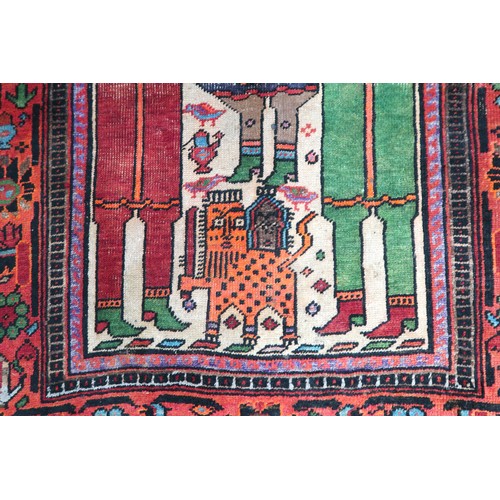 2138 - A BEIGE GROUND IRANIAN LORI RUNNERcentral panel decorated with geometric figure on horseback over pa... 