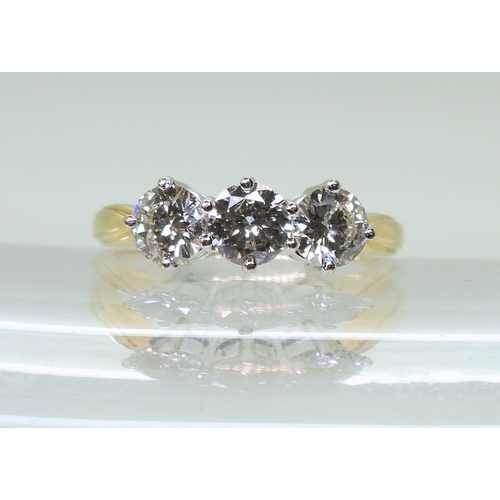 2839 - A THREE STONE DIAMOND RINGset with estimated approx 1.50cts of brilliant cut diamonds, in a classic ... 