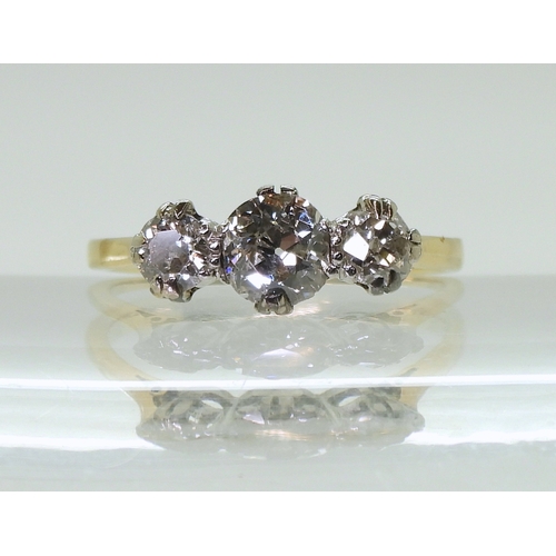 2840 - AN OLD CUT THREE STONE RINGset with three old cut diamonds with a combined diamond total of 0.70cts,... 