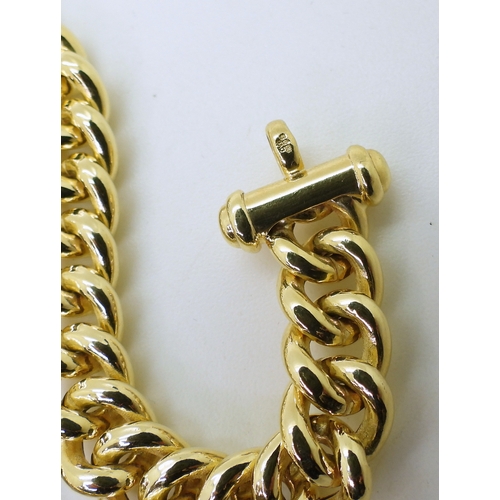 2842 - A 9CT GOLD CURB CHAINwith decorative oversize bolt ring closure. Width of the chain approx 9.1mm, le... 