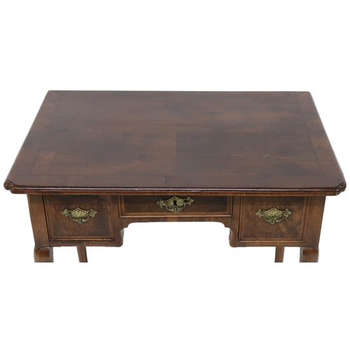 2048 - A 19TH CENTURY MAHOGANY LOWBOYwith shaped crossbanded veneered top over shallow central drawer flank... 