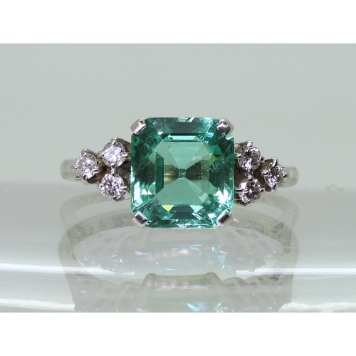 2826 - AN EMERALD AND DIAMOND RINGset in 18ct white gold and platinum, with a step cut emerald of approx 8.... 