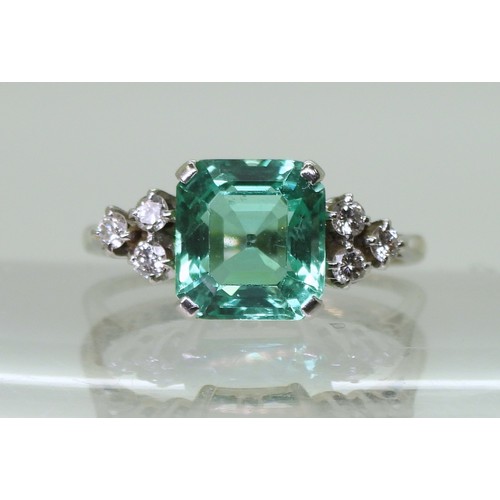 2826 - AN EMERALD AND DIAMOND RINGset in 18ct white gold and platinum, with a step cut emerald of approx 8.... 