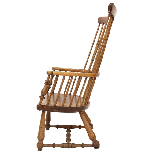 2053 - A 19TH CENTURY ELM DARVEL CHAIR ATTRIBUTED TO SHEILDS & SONwith comb back over hoop arms with tu... 