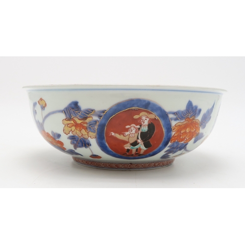 2393 - AN IMARI 'BLACK SHIP' BOWLdecorated with ships and figures on a diaper pattern ground, 25.5cm diamet... 