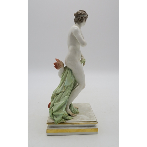 2273 - A MEISSEN FIGURE OF VENUSmodelled standing beside a grotesque dolphin, 25cm high... 