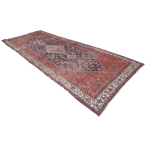 2139 - A LARGE BLUE GROUND HAMADAN CARPET with cream diamond central medallion on geometric floral pat... 