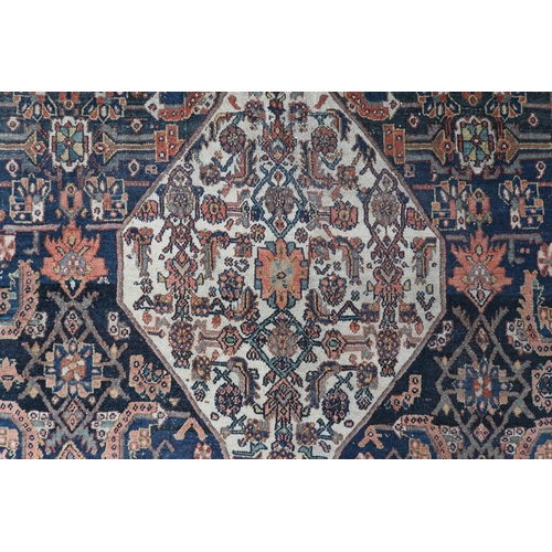 2139 - A LARGE BLUE GROUND HAMADAN CARPET with cream diamond central medallion on geometric floral pat... 