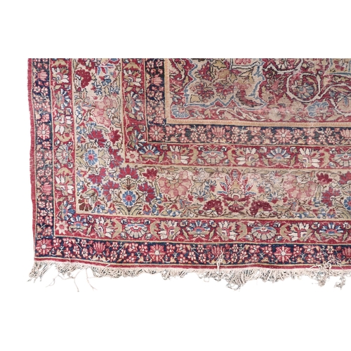 2141 - A BEIGE GROUND TABRIZ RUG with multicoloured floral central medallion on floral patterned groun... 