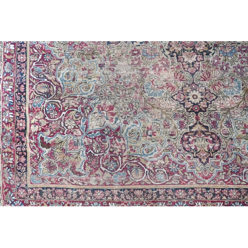 2141 - A BEIGE GROUND TABRIZ RUG with multicoloured floral central medallion on floral patterned groun... 