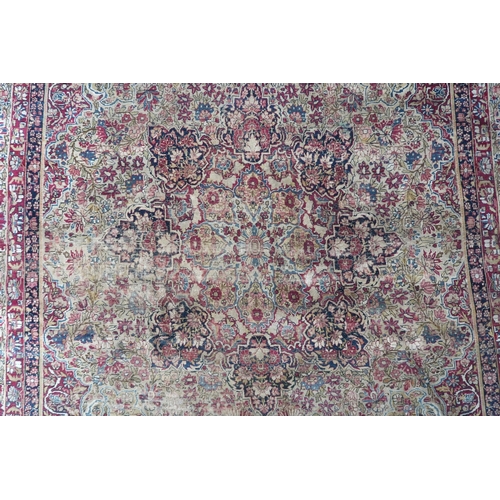 2141 - A BEIGE GROUND TABRIZ RUG with multicoloured floral central medallion on floral patterned groun... 