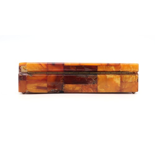 2601A - AN AMBER-TILED CIGARETTE BOXWith plaque affixed to base reading 